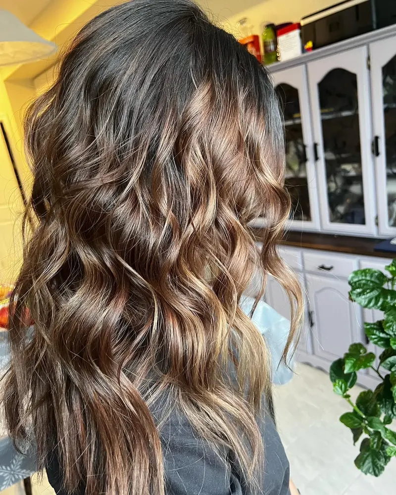 Brunette balayage with loose curls